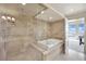 Spa-like bathroom with soaking tub and glass shower at 9103 Alta Dr # 1101, Las Vegas, NV 89145