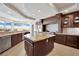 Spacious kitchen with granite countertops, island, and city views at 9103 Alta Dr # 1101, Las Vegas, NV 89145