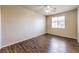 Bright bedroom with wood-look floors and ceiling fan at 11368 Rancho Portena Ave, Las Vegas, NV 89138