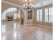 Spacious dining room with tile floors and a chandelier at 11368 Rancho Portena Ave, Las Vegas, NV 89138