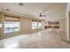 Gathering room with kitchen views and tile flooring at 11368 Rancho Portena Ave, Las Vegas, NV 89138