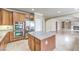 Kitchen features double ovens, granite island, and stainless steel refrigerator at 11368 Rancho Portena Ave, Las Vegas, NV 89138