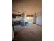 Kitchen with dark cabinets and a view to the dining area at 1181 Carson St, Pahrump, NV 89048