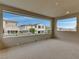 Covered balcony overlooking neighboring homes at 12118 Hermesa Colina Ave, Las Vegas, NV 89138