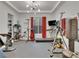 Home gym with a treadmill, weights, and a punching bag at 12118 Hermesa Colina Ave, Las Vegas, NV 89138