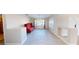 Bright living room with hardwood floors and a red accent chair and bay window at 1311 E Bowler Dr, Pahrump, NV 89048