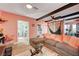 Bright living room with L-shaped sofa and view into kitchen at 207 W Victory Rd, Henderson, NV 89015