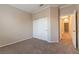 Bright bedroom with double door closet and access to hallway at 2277 Black Pine Dr, Las Vegas, NV 89134