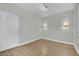 Bedroom with wood floors, door and wall sconces at 2813 Vista Butte Dr, Las Vegas, NV 89134