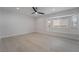 Bright bedroom with ceiling fan and wood-look floors at 303 Vallarte Dr, Henderson, NV 89014