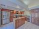 Spacious kitchen with island, stainless steel appliances, and wood cabinets at 380 E Maulding Ave, Las Vegas, NV 89123