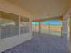 Covered patio overlooking the pool area with brick paved flooring and a window at 380 E Maulding Ave, Las Vegas, NV 89123