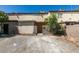 Tan stucco building with gated entry and parking lot at 3919 Visby Ln # 0, Las Vegas, NV 89119