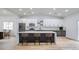 Virtually staged kitchen with modern cabinetry, large island, and stainless steel appliances at 413 Mulberry Glen Dr, North Las Vegas, NV 89031