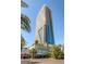 Impressive high-rise building, Palms Place, with modern architecture and palm trees at 4381 W Flamingo Rd # 2220, Las Vegas, NV 89103