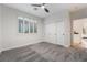 Bright bedroom with plush carpeting, large closet, and window with plantation shutters at 4414 Regalo Bello St, Las Vegas, NV 89135