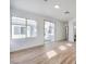 Light-filled bedroom with hardwood floors and sliding glass doors to backyard at 4623 Harvest Night St, Las Vegas, NV 89129