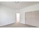 Spacious bedroom with grey carpet and double sliding doors at 4623 Harvest Night St, Las Vegas, NV 89129