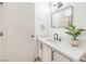 Modern bathroom with white vanity and black matte fixtures at 5186 Jewel Canyon Dr, Las Vegas, NV 89122