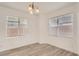 Bright dining room with hardwood floors and large windows at 6004 Rampolla Dr, Las Vegas, NV 89141