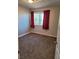 Simple bedroom with neutral carpeting and window at 6411 Sandpiper Way, Las Vegas, NV 89103