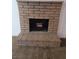 Brick fireplace in the living room, ready for cozy nights at 6411 Sandpiper Way, Las Vegas, NV 89103