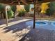 Brick patio with spa and swimming pool at 6411 Sandpiper Way, Las Vegas, NV 89103