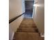 Carpeted staircase leading to the lower level at 6411 Sandpiper Way, Las Vegas, NV 89103