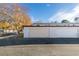 Attached garage with automatic door opener and ample storage space at 647 Greenbriar Townhouse Way, Las Vegas, NV 89121