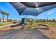 Modern playground equipment under a shaded area at 6867 Evening Orchid St, North Las Vegas, NV 89086