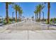 Community water feature with palm trees and benches at 6867 Evening Orchid St, North Las Vegas, NV 89086