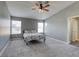 Primary bedroom with ceiling fan and gray walls at 7929 Tulum Ct, Las Vegas, NV 89145