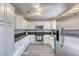 Modern kitchen with stainless steel appliances and dark granite countertops at 7929 Tulum Ct, Las Vegas, NV 89145