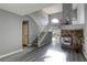 Living room with high ceilings, fireplace, and staircase at 7929 Tulum Ct, Las Vegas, NV 89145