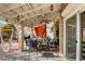 Relaxing patio with covered seating area and ceiling fan at 7929 Tulum Ct, Las Vegas, NV 89145