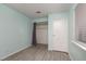 Bedroom with gray flooring, closet, and teal walls at 809 Hedge Way # 4, Las Vegas, NV 89110