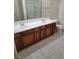 Bathroom with double vanity, tiled floors and shower at 8324 W Charleston Blvd # 2033, Las Vegas, NV 89117