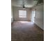 Living room with sliding door to balcony, ceiling fan and carpet at 8324 W Charleston Blvd # 2033, Las Vegas, NV 89117