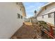 Side yard with chain link fence and small boat at 851 Toni Ave, Las Vegas, NV 89119