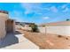 Backyard with block wall, gravel, and small plants at 8644 Highland View Ave, Las Vegas, NV 89145