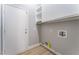 Laundry room with built-in shelving and vinyl flooring at 8644 Highland View Ave, Las Vegas, NV 89145