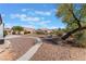 Landscaped backyard with gravel and a path at 8800 Sundial Dr, Las Vegas, NV 89134