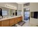 Well-appointed bathroom featuring double vanities and a view to the bedroom at 9520 Twelve Pins Dr, Las Vegas, NV 89129