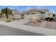 Single-story home with a two-car garage and RV parking at 9520 Twelve Pins Dr, Las Vegas, NV 89129