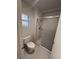 Small bathroom with a toilet and shower at 10013 Cresent Creek Dr, Las Vegas, NV 89134