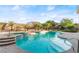 Relaxing pool area with a spa and waterfall feature at 10234 Renae Nicole Ct, Las Vegas, NV 89183