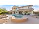 Inviting backyard oasis with a sparkling pool and spa at 10234 Renae Nicole Ct, Las Vegas, NV 89183