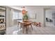 Dining area with wood table, window, and tile floor at 11016 Rossi Ave, Las Vegas, NV 89144