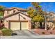 Two-story home with attached garage and landscaping at 11016 Rossi Ave, Las Vegas, NV 89144