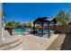 Relaxing backyard oasis with a sparkling pool and gazebo at 11154 Grants Landing Ct, Las Vegas, NV 89141